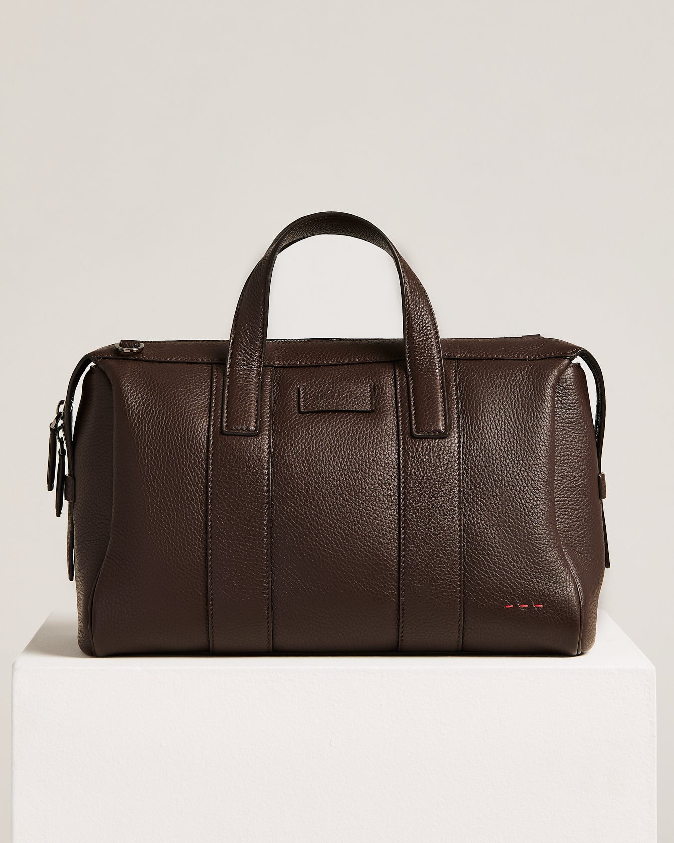 dark brown stag-leather travel bag